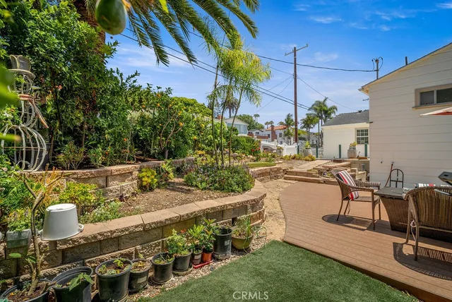 a view of a chair and tables in the backyard