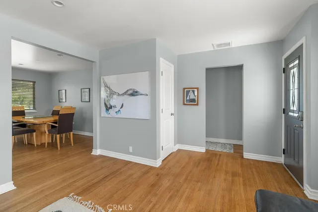 a view of a livingroom with furniture and wooden floor