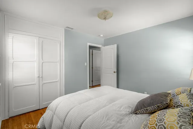 a bedroom with a bed and a bathroom