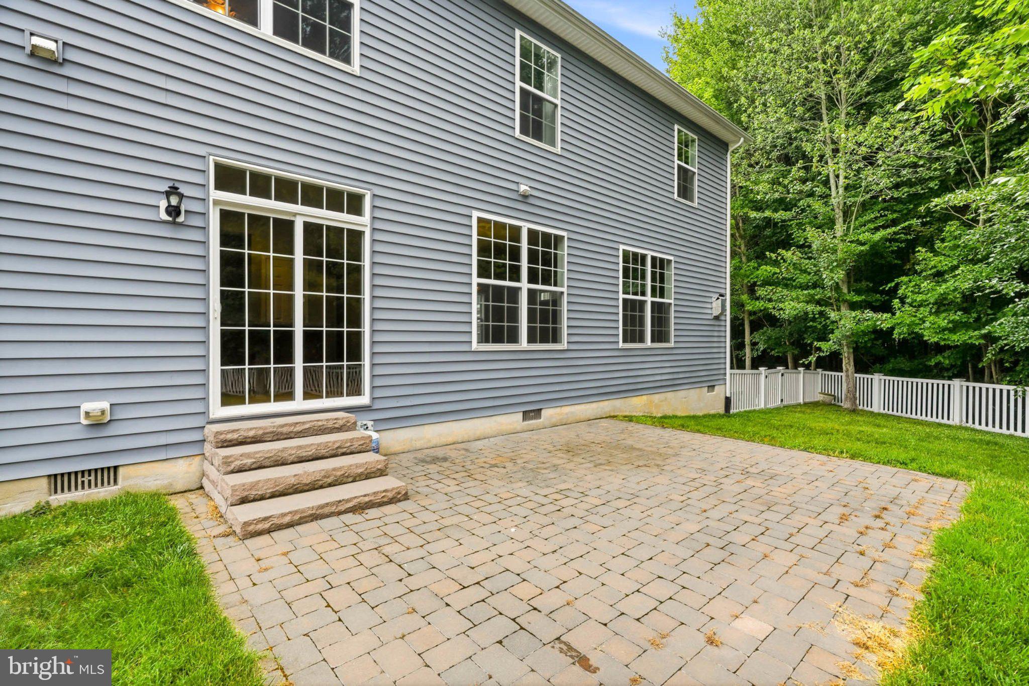 706 Trapper Way Deale, MD 20751 - Photo 47 of 61 Charming patio with lush greenery backdrop.