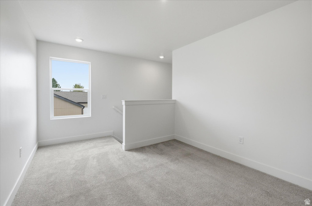 844 North 400 West Logan, UT 84321 - Photo 16 of 43 Carpeted room featuring a single window with white trim, white walls, and recessed lighting