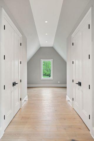 an aerial view of a house with swimming pool and garden