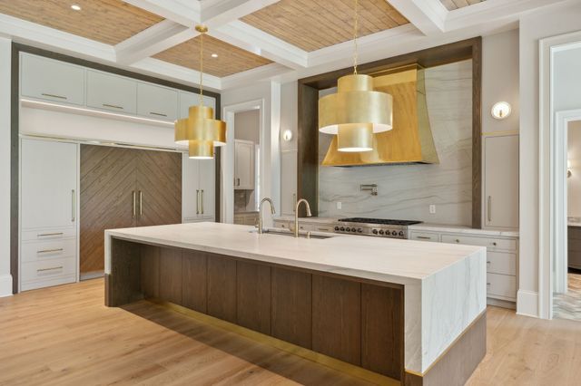 a spacious bathroom with a granite countertop sink and a mirror