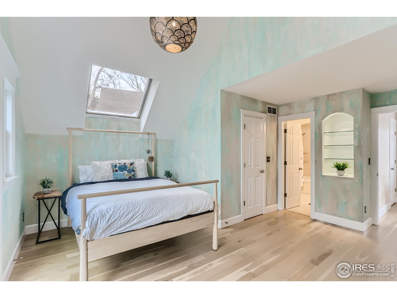 1109 Mapleton Avenue Boulder, CO 80304 - Photo 13 of 27 a bedroom with a bed and a mirror