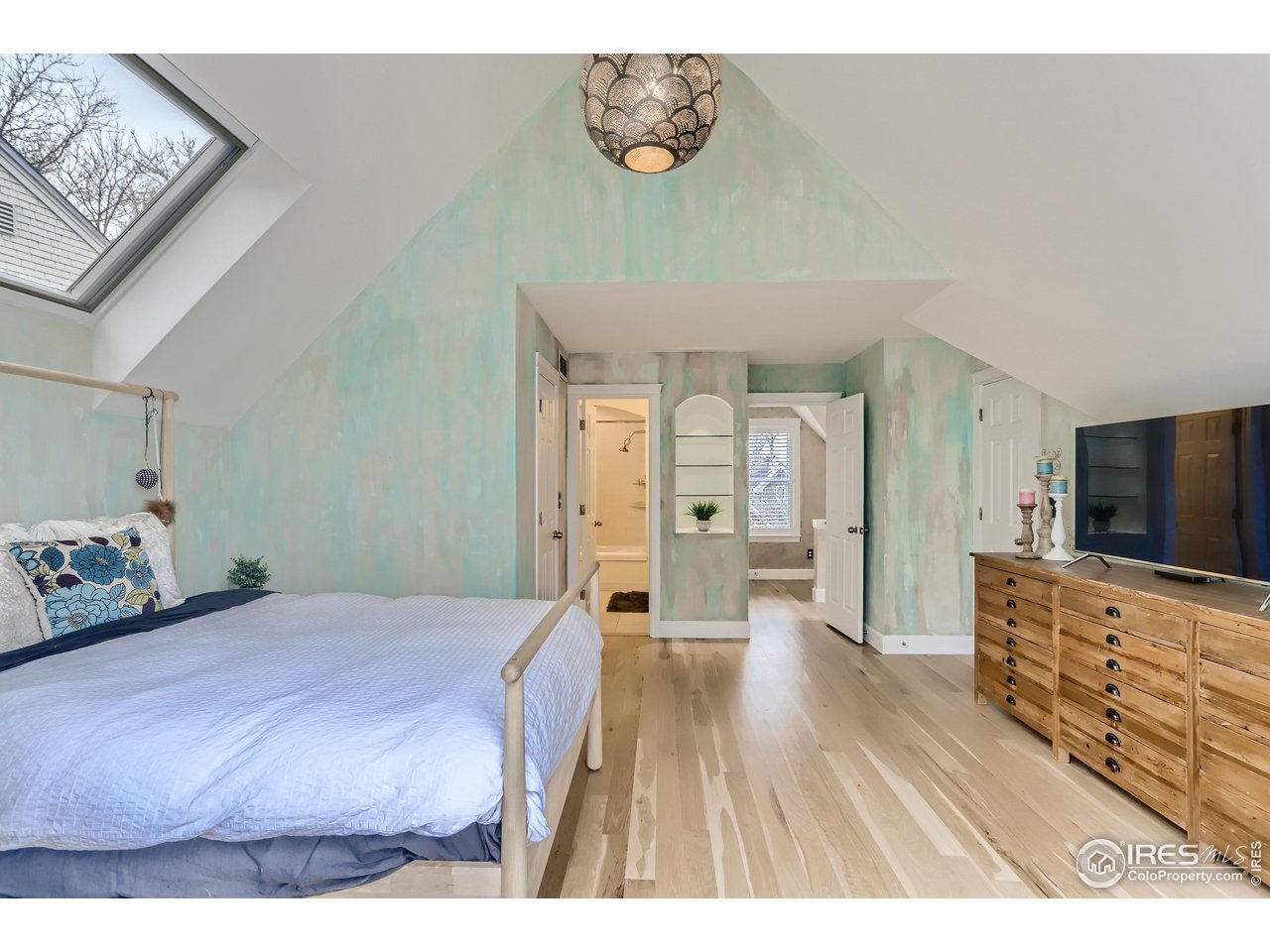 1109 Mapleton Avenue Boulder, CO 80304 - Photo 14 of 27 a bedroom with a bed and a flat screen tv