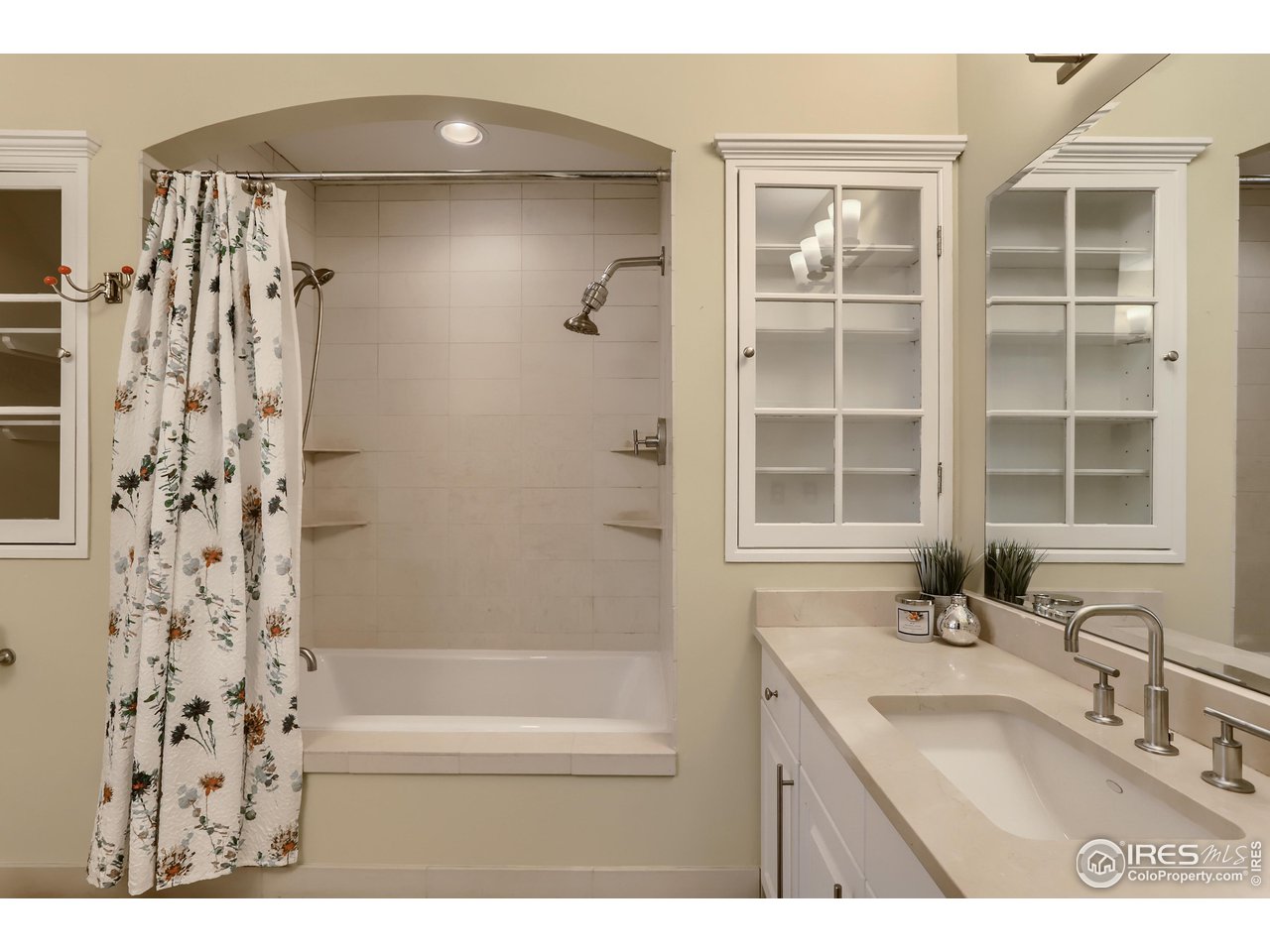 1109 Mapleton Avenue Boulder, CO 80304 - Photo 15 of 27 a bathroom with a granite countertop sink a toilet and shower