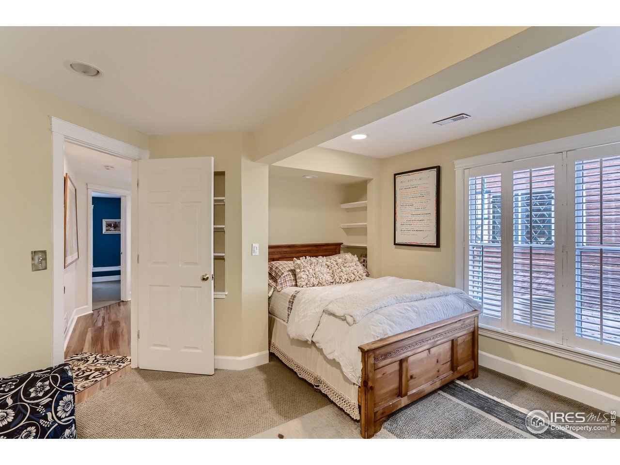 1109 Mapleton Avenue Boulder, CO 80304 - Photo 18 of 27 a bedroom with a bed lamp and a large window