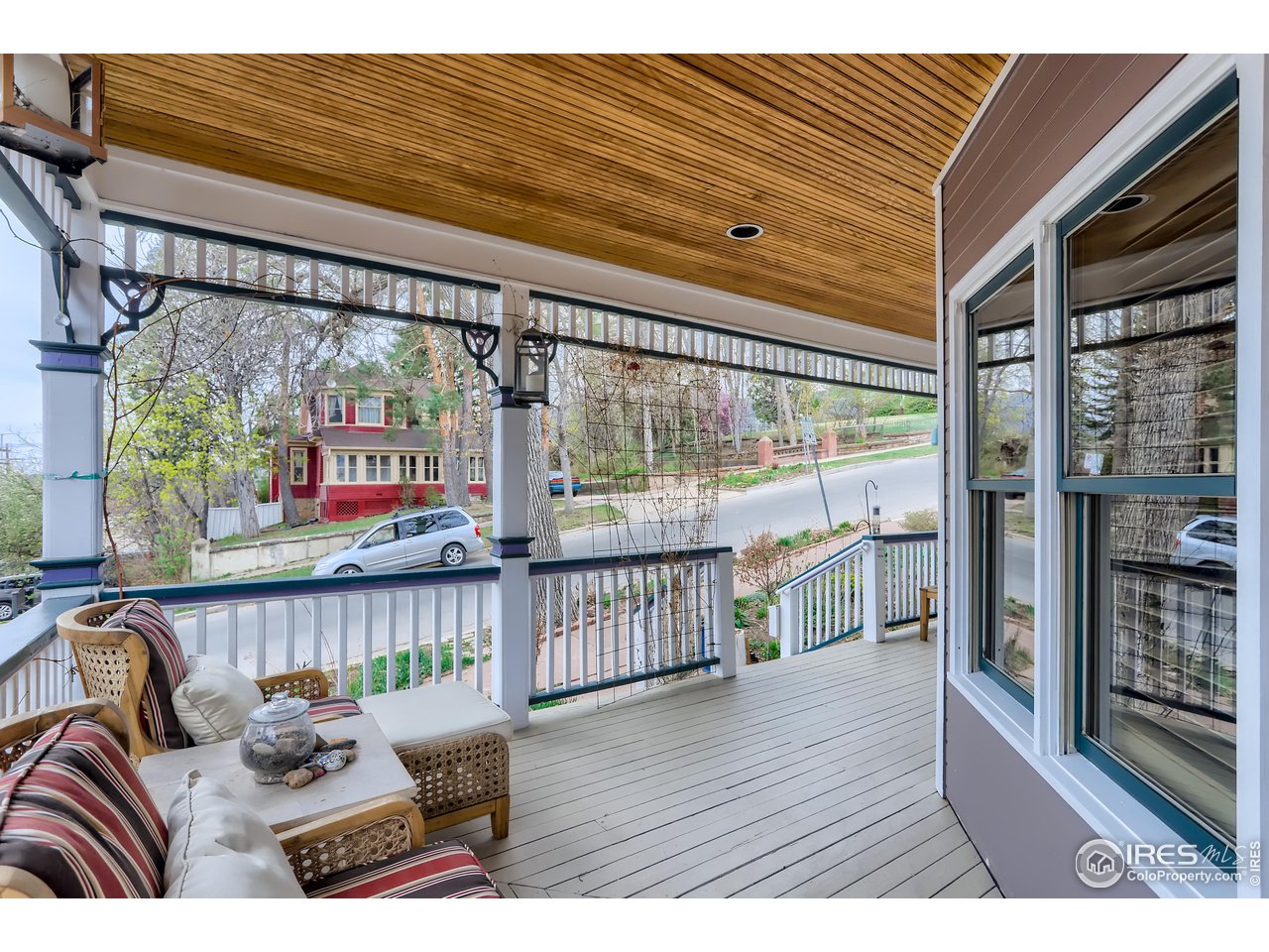 1109 Mapleton Avenue Boulder, CO 80304 - Photo 3 of 27 a balcony with furniture and wooden floor