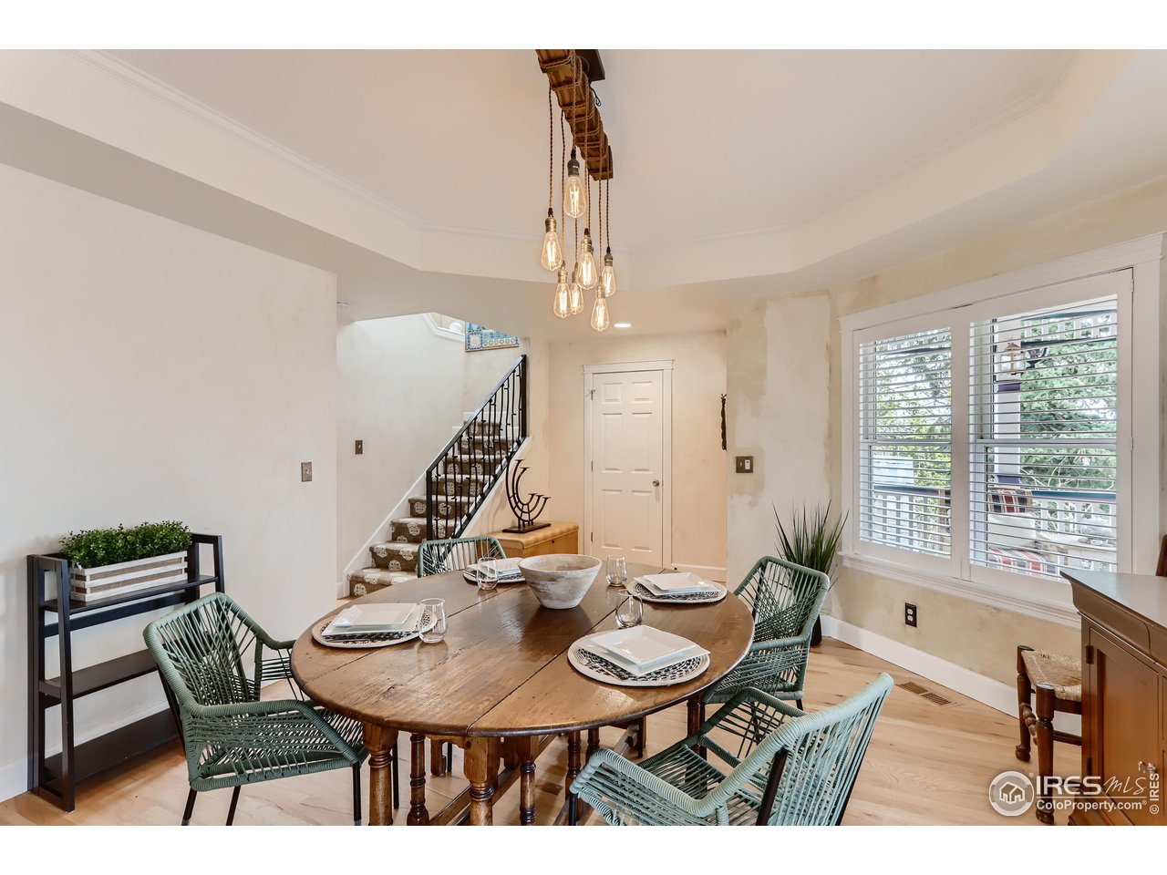 1109 Mapleton Avenue Boulder, CO 80304 - Photo 7 of 27 a view of a dining room with furniture and a chandelier