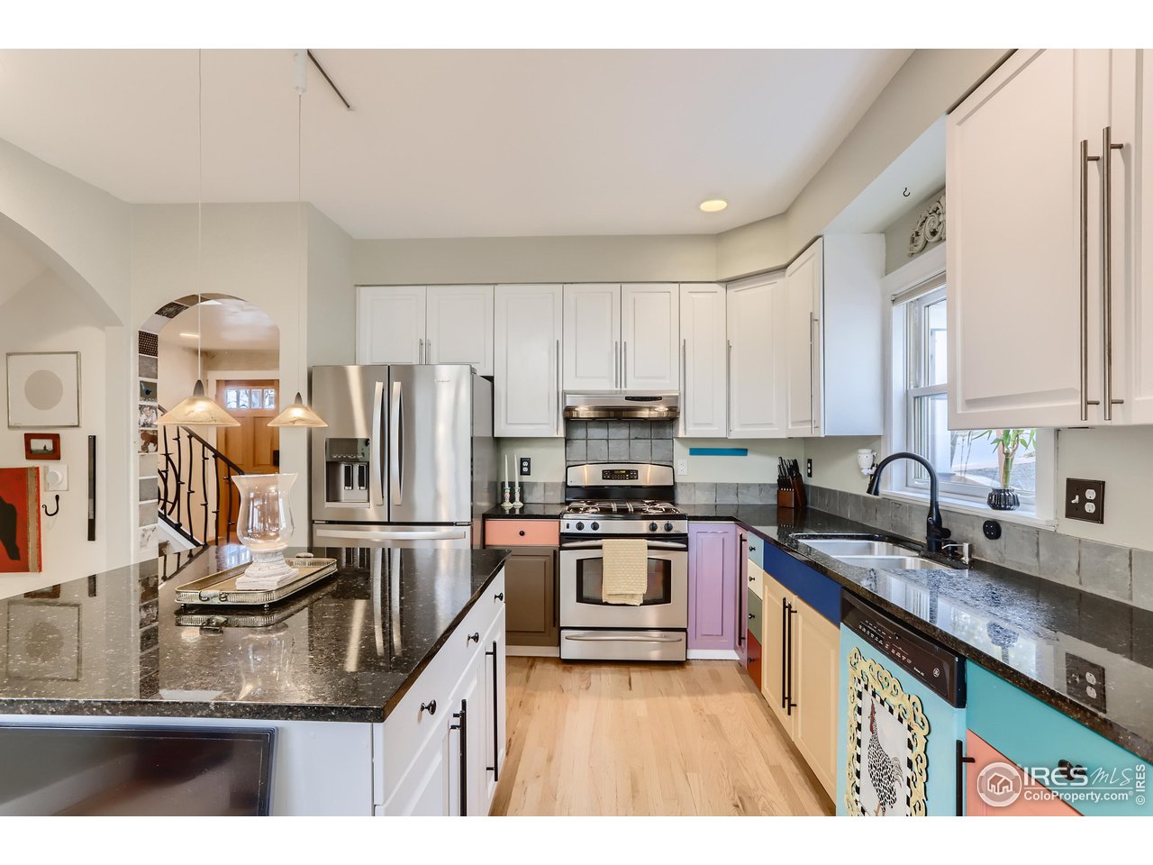 1109 Mapleton Avenue Boulder, CO 80304 - Photo 9 of 27 a kitchen with kitchen island granite countertop a sink stove and refrigerator