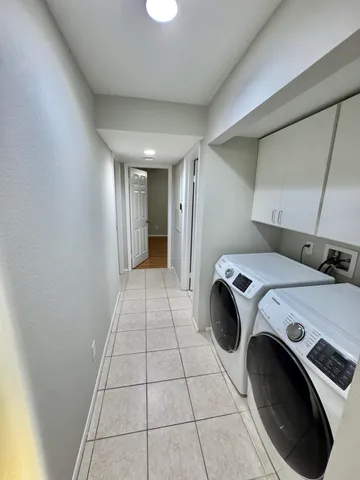 a view of utility room and washer and dryer