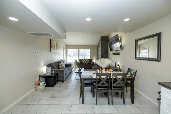 a view of a livingroom with furniture and a window