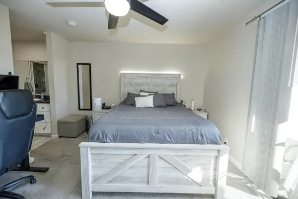 a bedroom with a bed and window