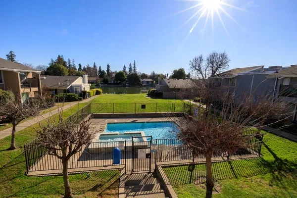 a view of a house with a deck back yard