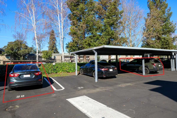 a kitchen with a sink and wooden floor