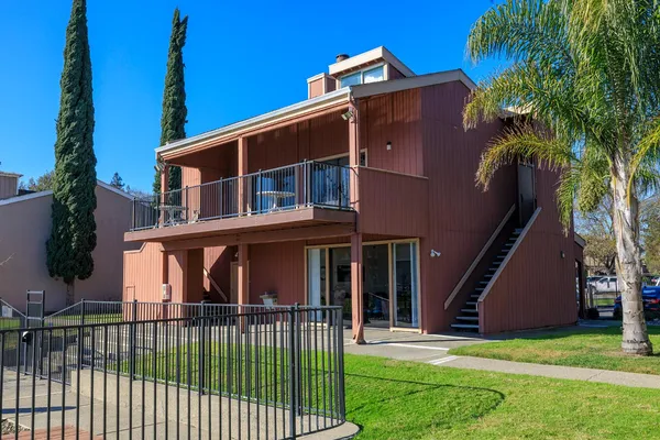 a ocean view with boat and palm trees
