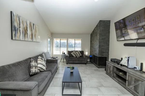 a living room with furniture and a large window