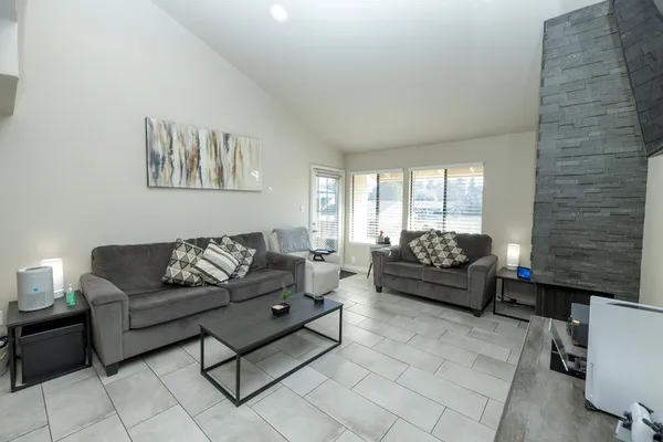 a living room with furniture and a gate