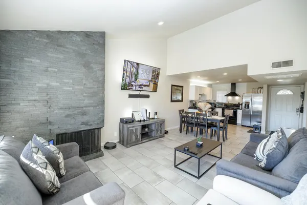 a living room with furniture and a fireplace