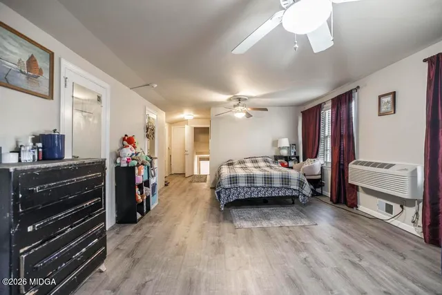 a bedroom with a bed and a dresser