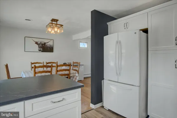 a view of cabinets and refrigerator