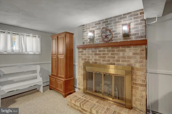 a kitchen with granite countertop white cabinets and stainless steel appliances