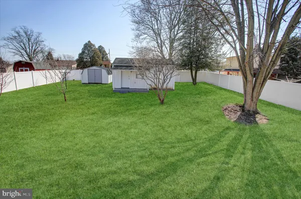 a view of a patio with table and chairs