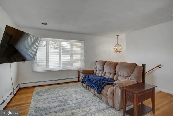 a living room with a couch and a flat screen tv