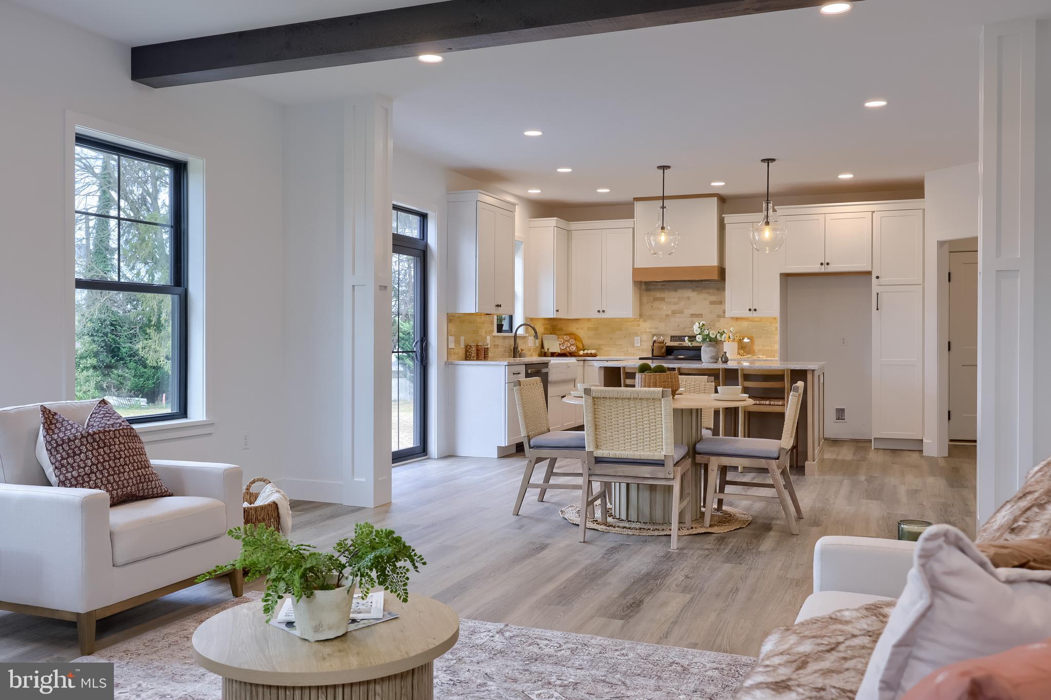 514 Woodcrest Avenue Lititz, PA 17543 - Photo 11 of 64 a living room with stainless steel appliances kitchen island granite countertop furniture and a large window