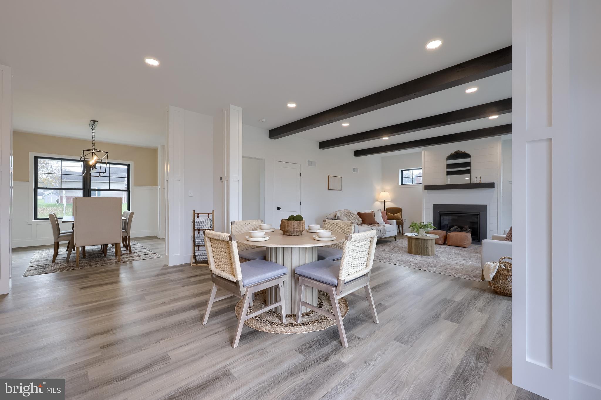 514 Woodcrest Avenue Lititz, PA 17543 - Photo 12 of 64 a view of a dining room with furniture window and wooden floor
