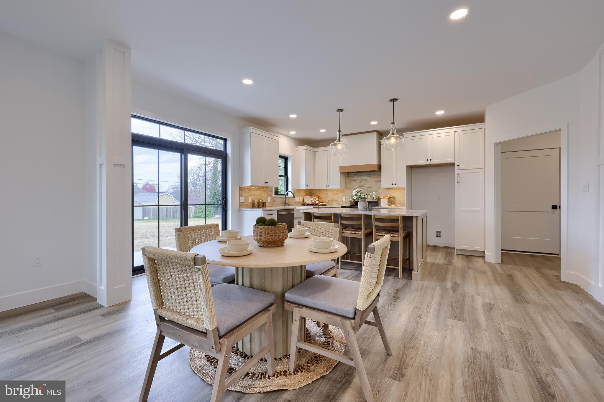 514 Woodcrest Avenue Lititz, PA 17543 - Photo 13 of 64 a view of a dining room with furniture window and wooden floor