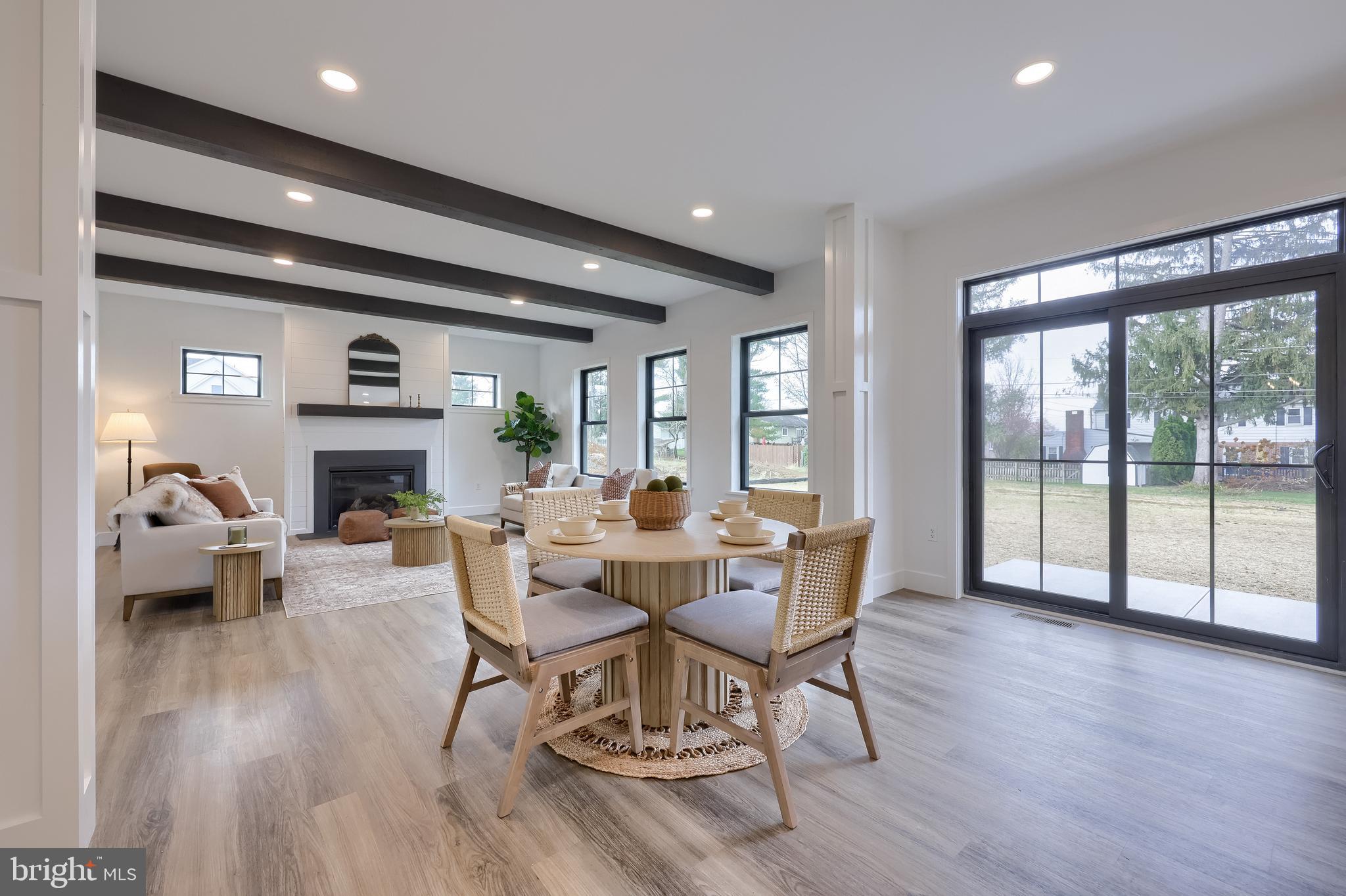514 Woodcrest Avenue Lititz, PA 17543 - Photo 16 of 64 a living room with fireplace furniture and a large window