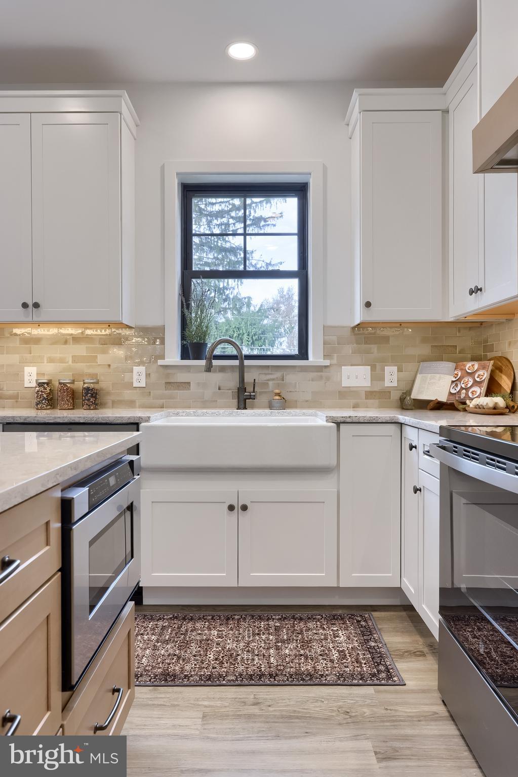 514 Woodcrest Avenue Lititz, PA 17543 - Photo 20 of 64 a kitchen with a sink cabinets appliances and a window