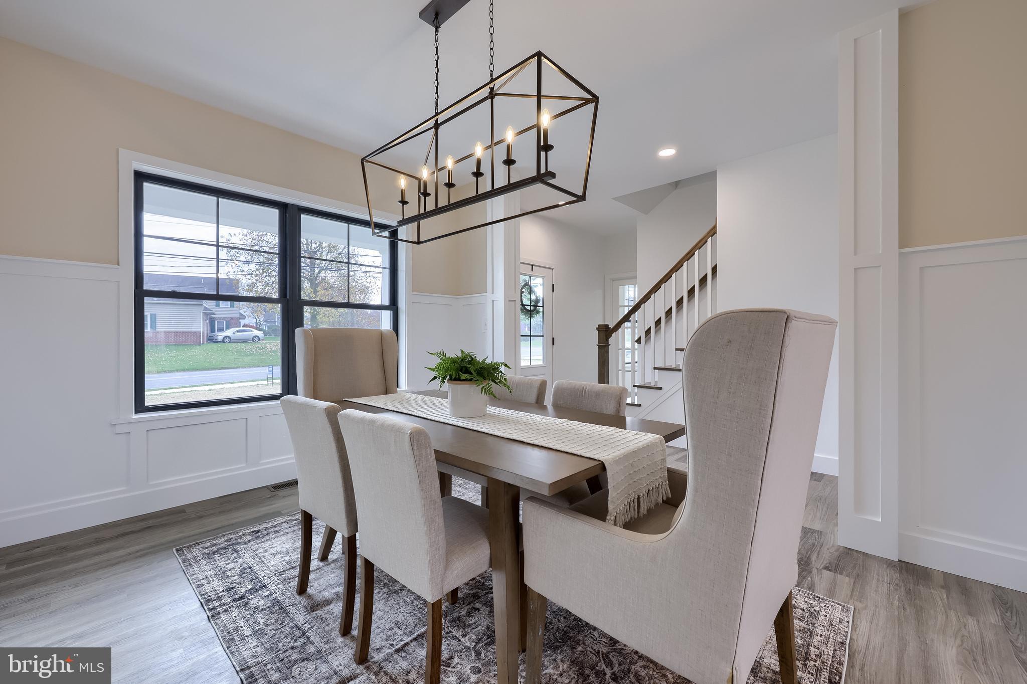 514 Woodcrest Avenue Lititz, PA 17543 - Photo 36 of 64 a view of a dining room with furniture window and wooden floor