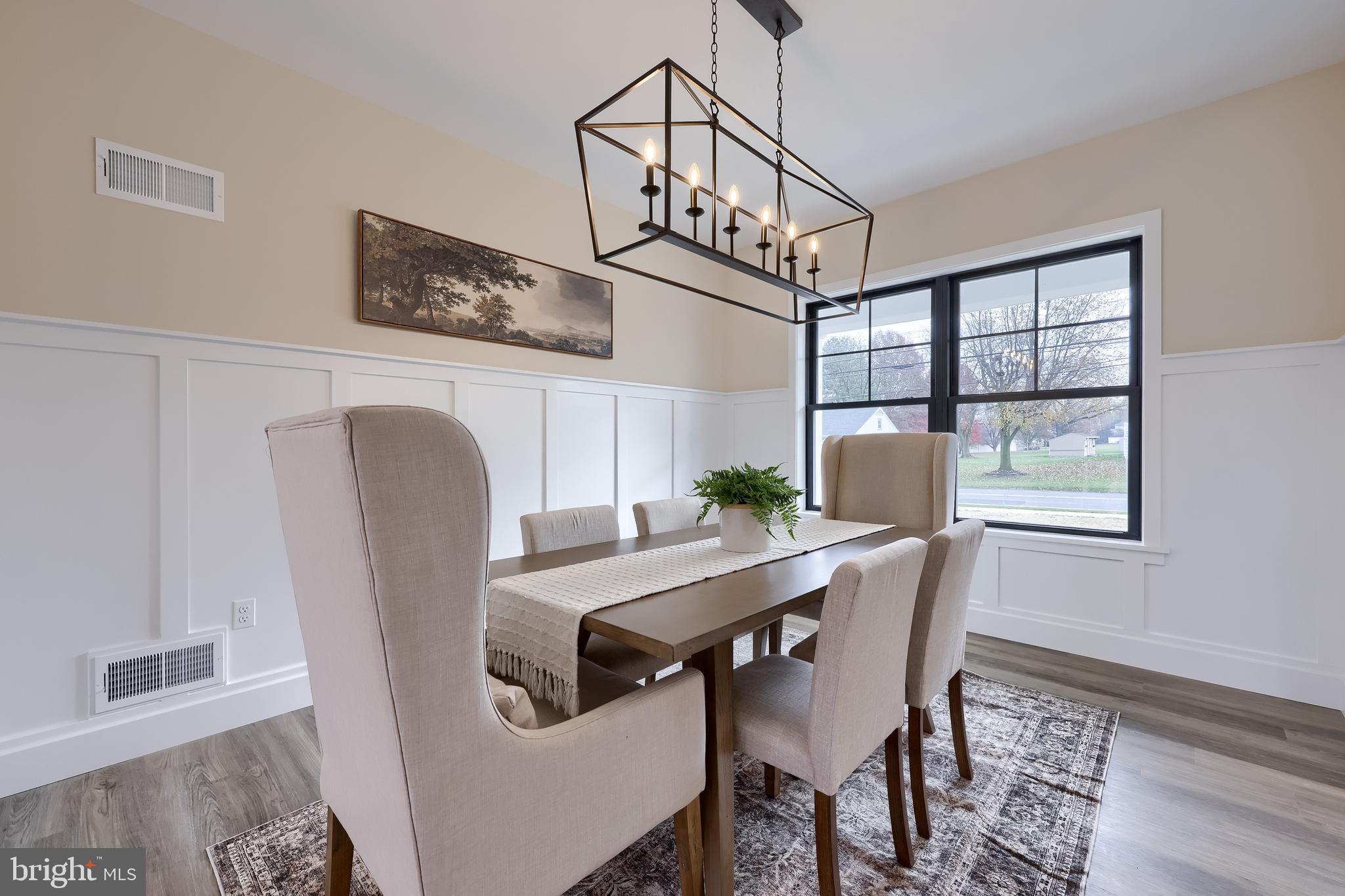 514 Woodcrest Avenue Lititz, PA 17543 - Photo 37 of 64 a view of a dining room with furniture window and wooden floor