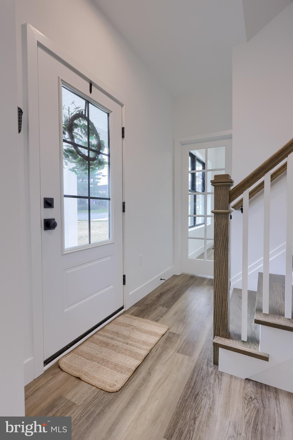 514 Woodcrest Avenue Lititz, PA 17543 - Photo 40 of 64 an empty room with wooden floor and windows