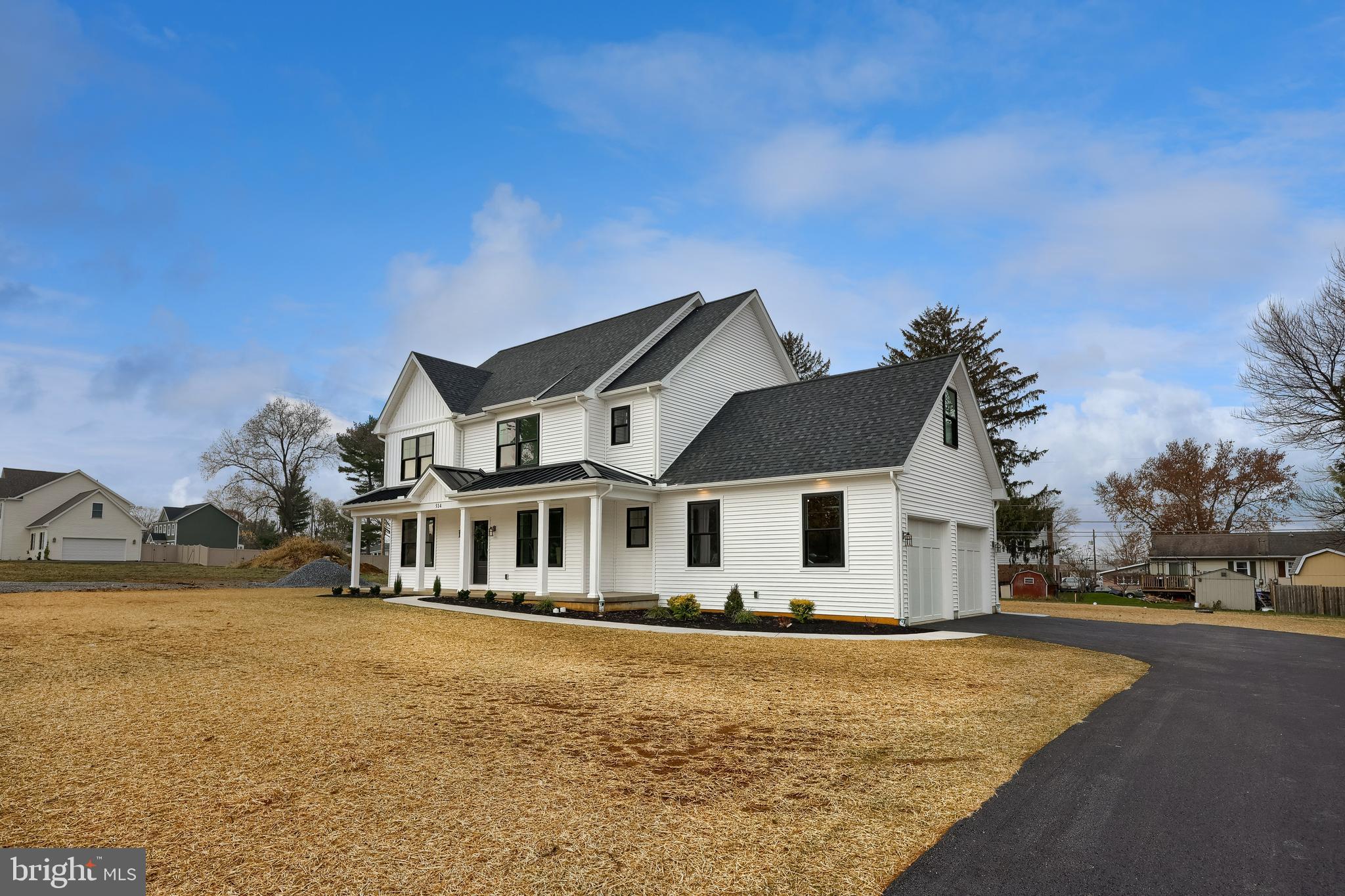 514 Woodcrest Avenue Lititz, PA 17543 - Photo 4 of 64 a front view of a house with a yard