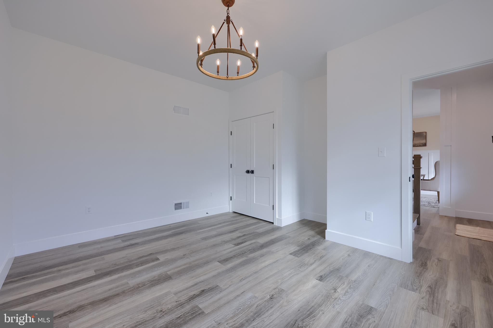 514 Woodcrest Avenue Lititz, PA 17543 - Photo 41 of 64 a view of empty room with wooden floor and stove