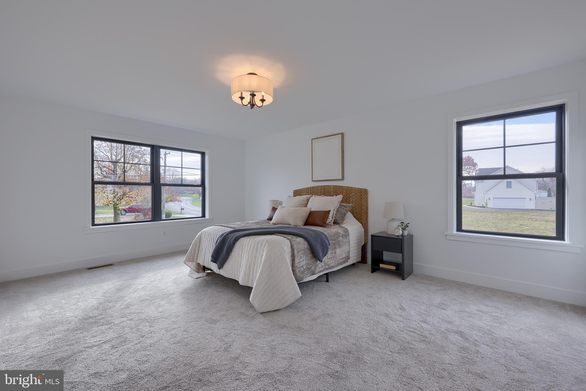 514 Woodcrest Avenue Lititz, PA 17543 - Photo 46 of 64 a spacious bedroom with a bed and a window