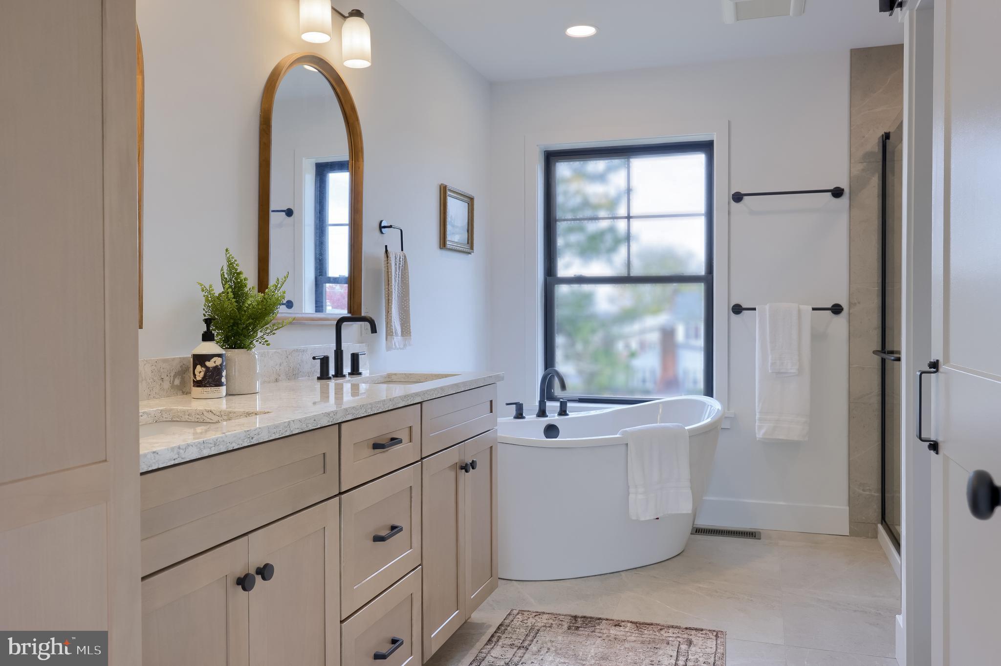514 Woodcrest Avenue Lititz, PA 17543 - Photo 48 of 64 a bathroom with a double vanity sink mirror and bathtub