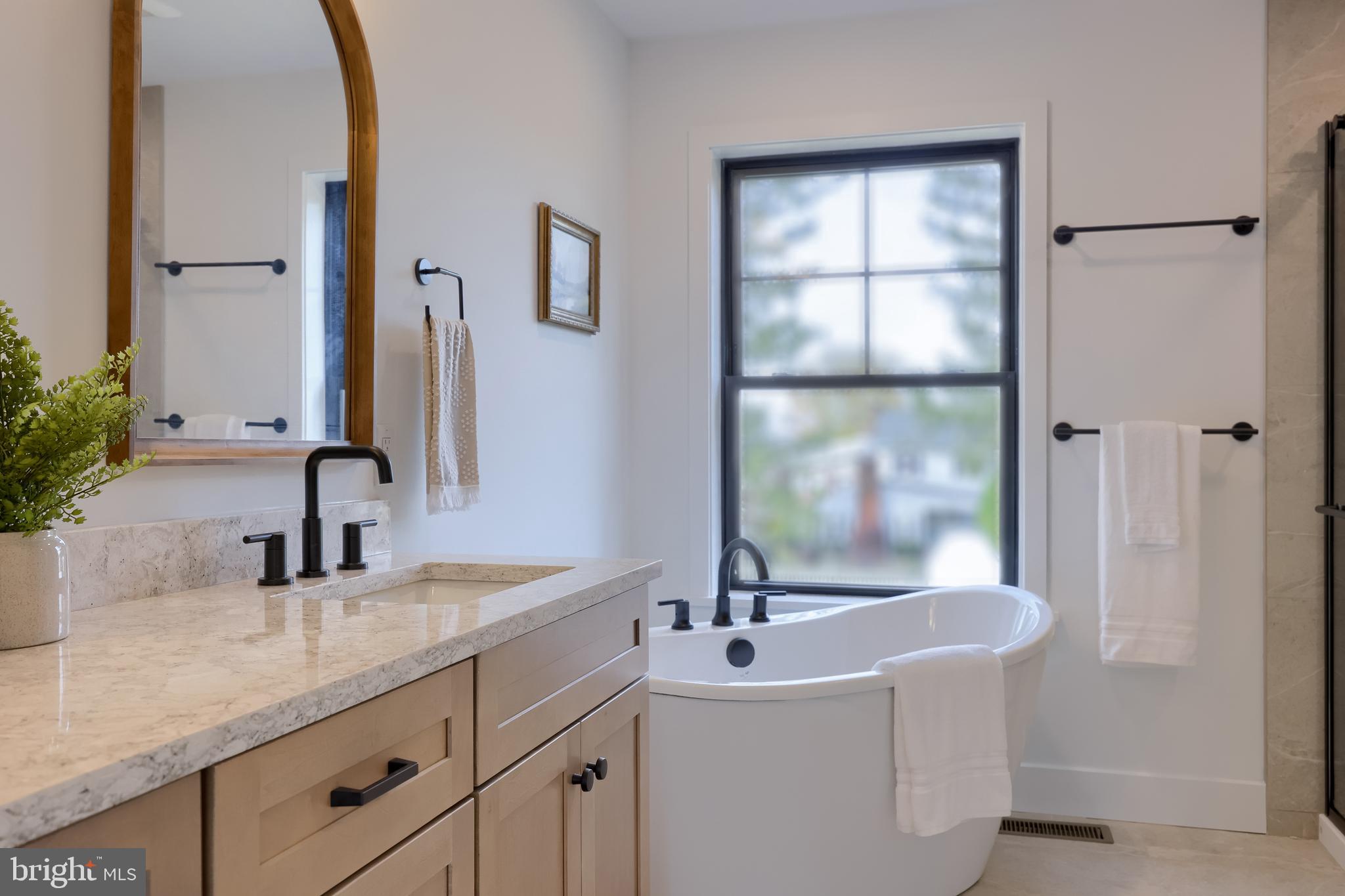 514 Woodcrest Avenue Lititz, PA 17543 - Photo 50 of 64 a bathroom with a tub sink and mirror