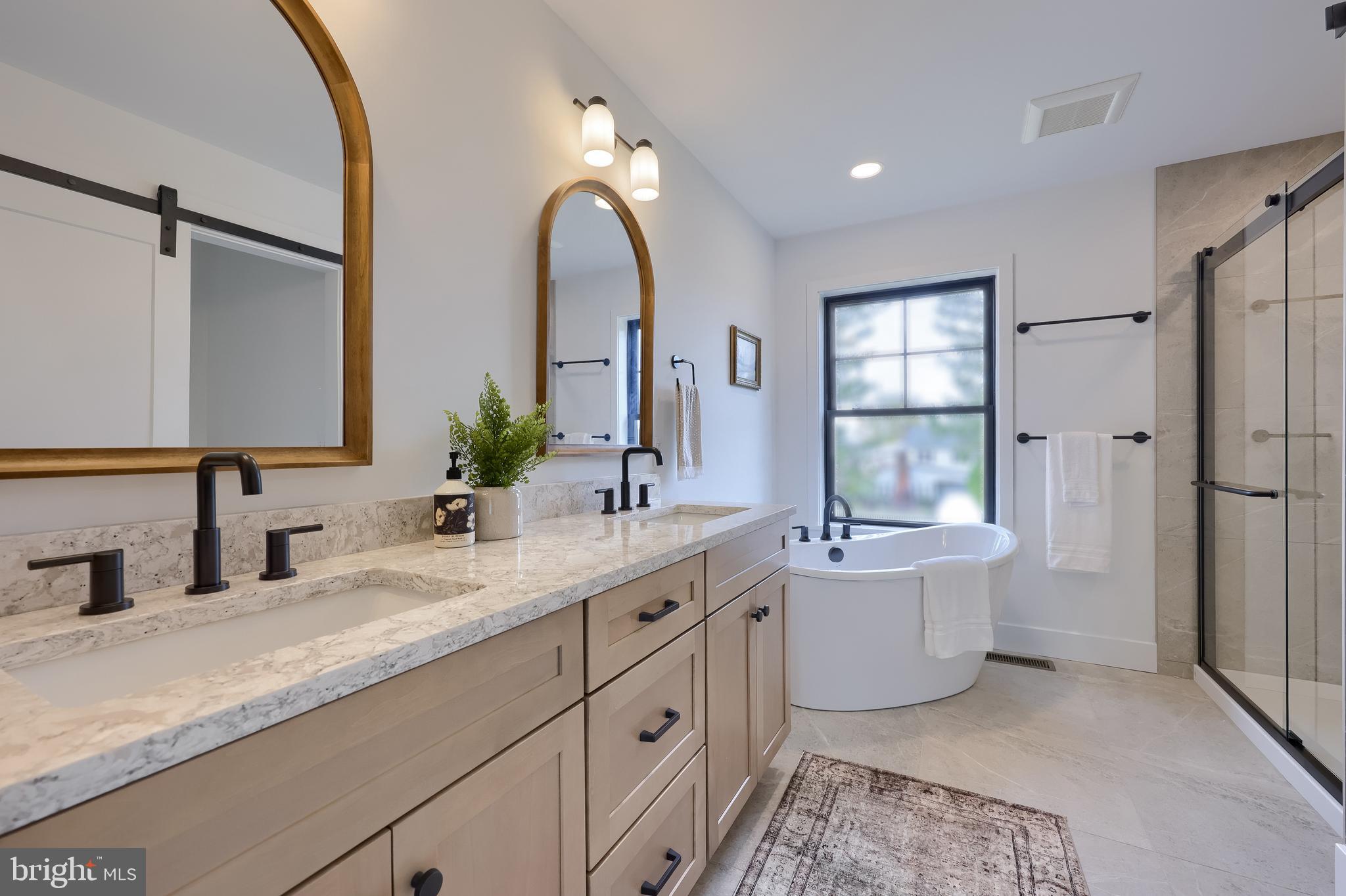 514 Woodcrest Avenue Lititz, PA 17543 - Photo 52 of 64 a bathroom with a double vanity sink mirror and shower