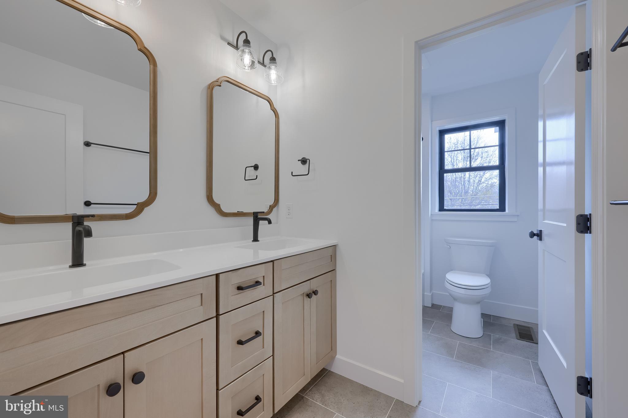 514 Woodcrest Avenue Lititz, PA 17543 - Photo 56 of 64 a bathroom with 2 sink toilet and a mirror