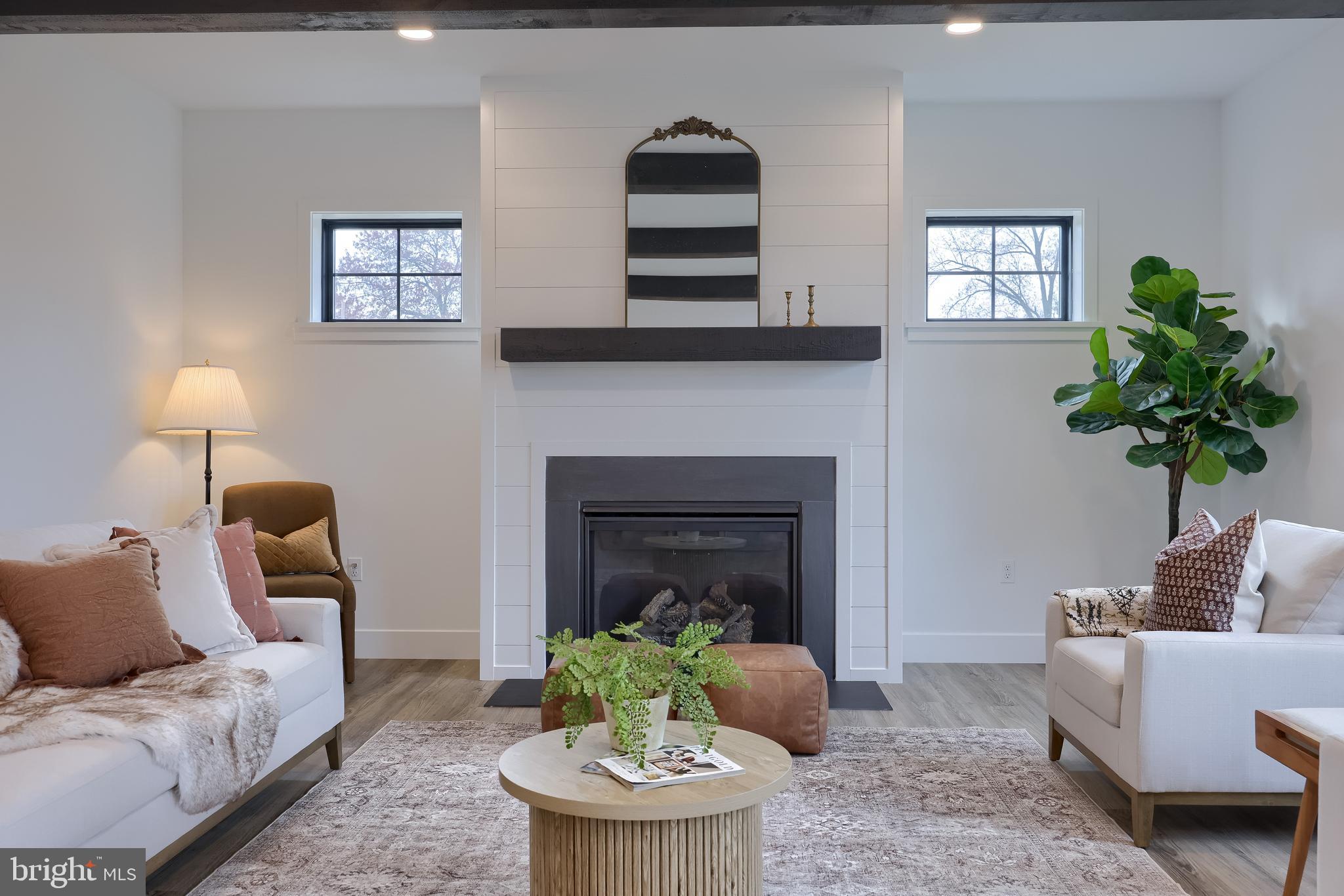 514 Woodcrest Avenue Lititz, PA 17543 - Photo 6 of 64 a living room with furniture and a fireplace