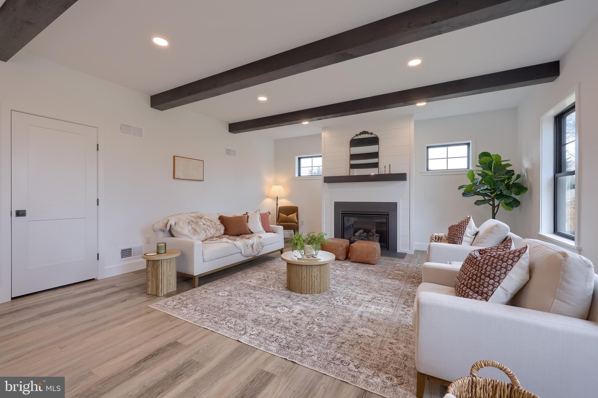 514 Woodcrest Avenue Lititz, PA 17543 - Photo 8 of 64 a living room with furniture and a fireplace