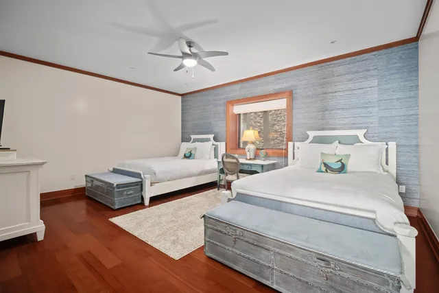 a bedroom with bed and window