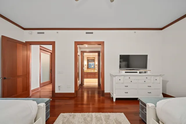 a living room with furniture and flat screen tv