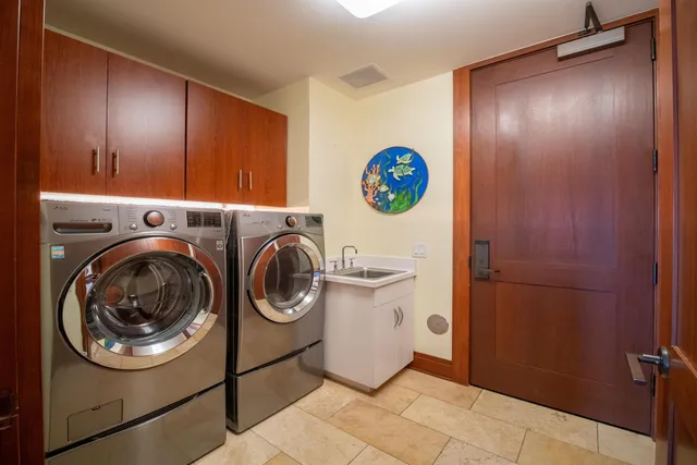 a view of storage and utility room with washer and dryer