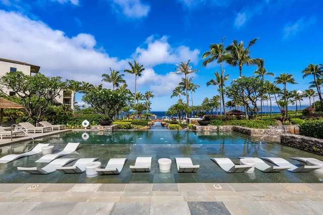 a view of swimming pool with outdoor seating