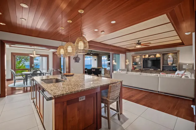a kitchen with center island and stainless steel appliances